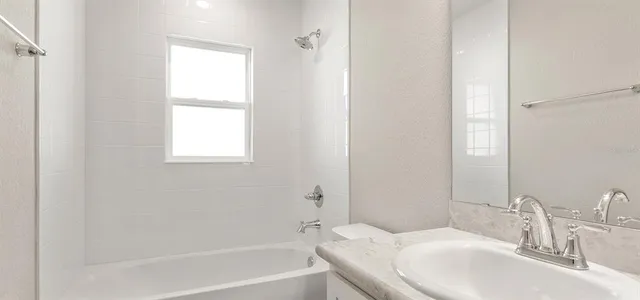 a bathroom with a sink and a bathtub