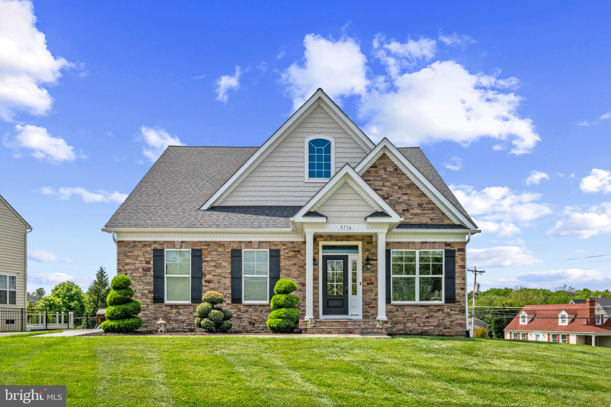 9736 Cross Road Perry Hall, MD 21128 - Photo 1 of 32 a front view of a house with garden