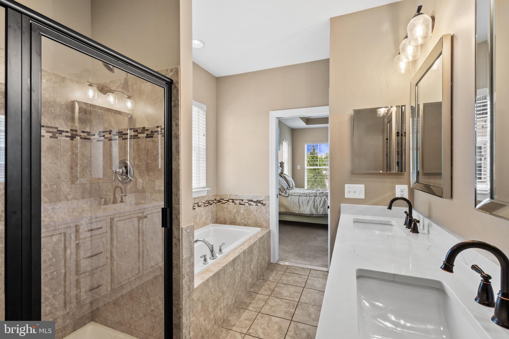 9736 Cross Road Perry Hall, MD 21128 - Photo 20 of 32 a bathroom with a tub sink and mirror