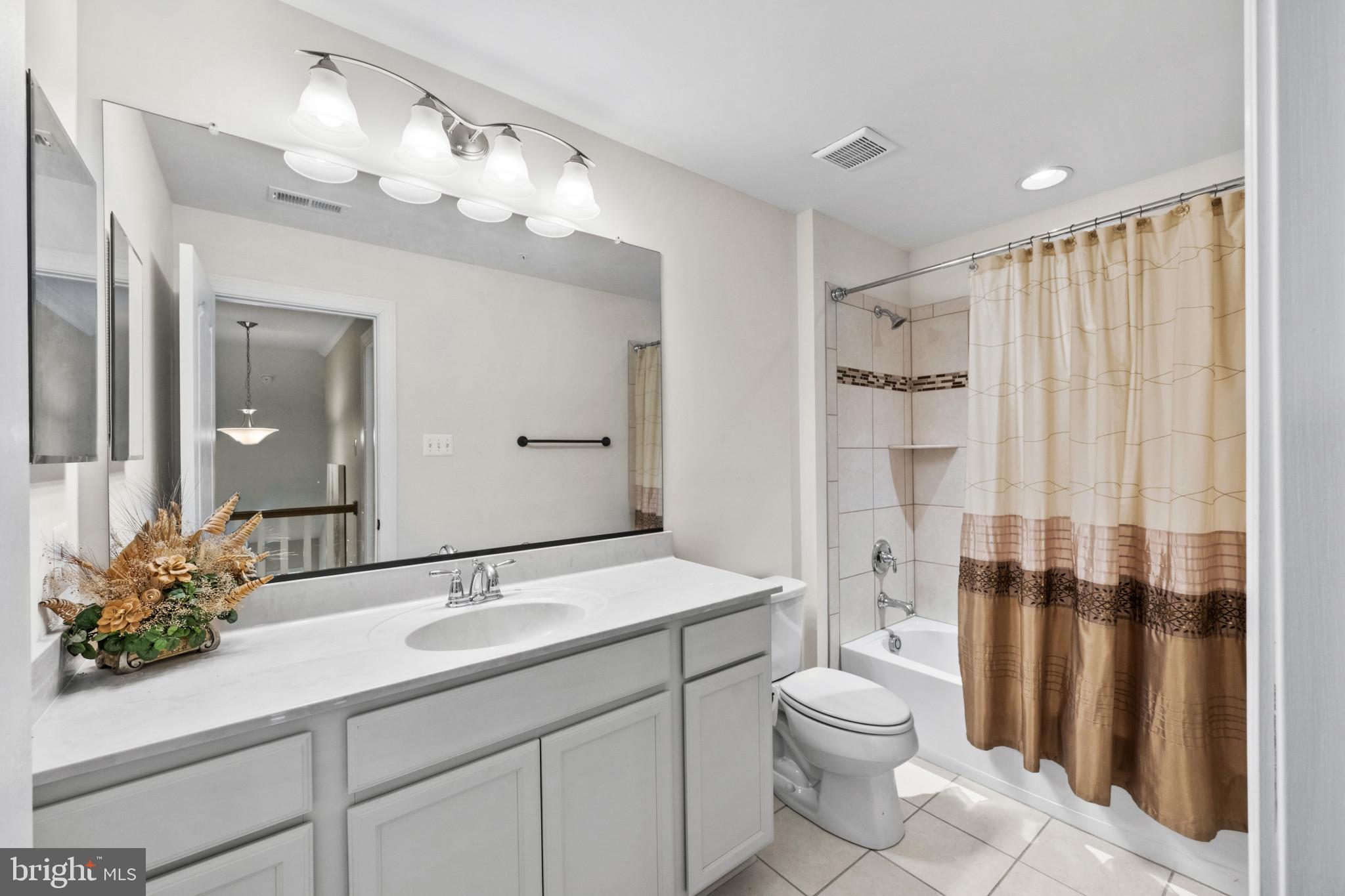 9736 Cross Road Perry Hall, MD 21128 - Photo 25 of 32 a bathroom with a sink a toilet and shower