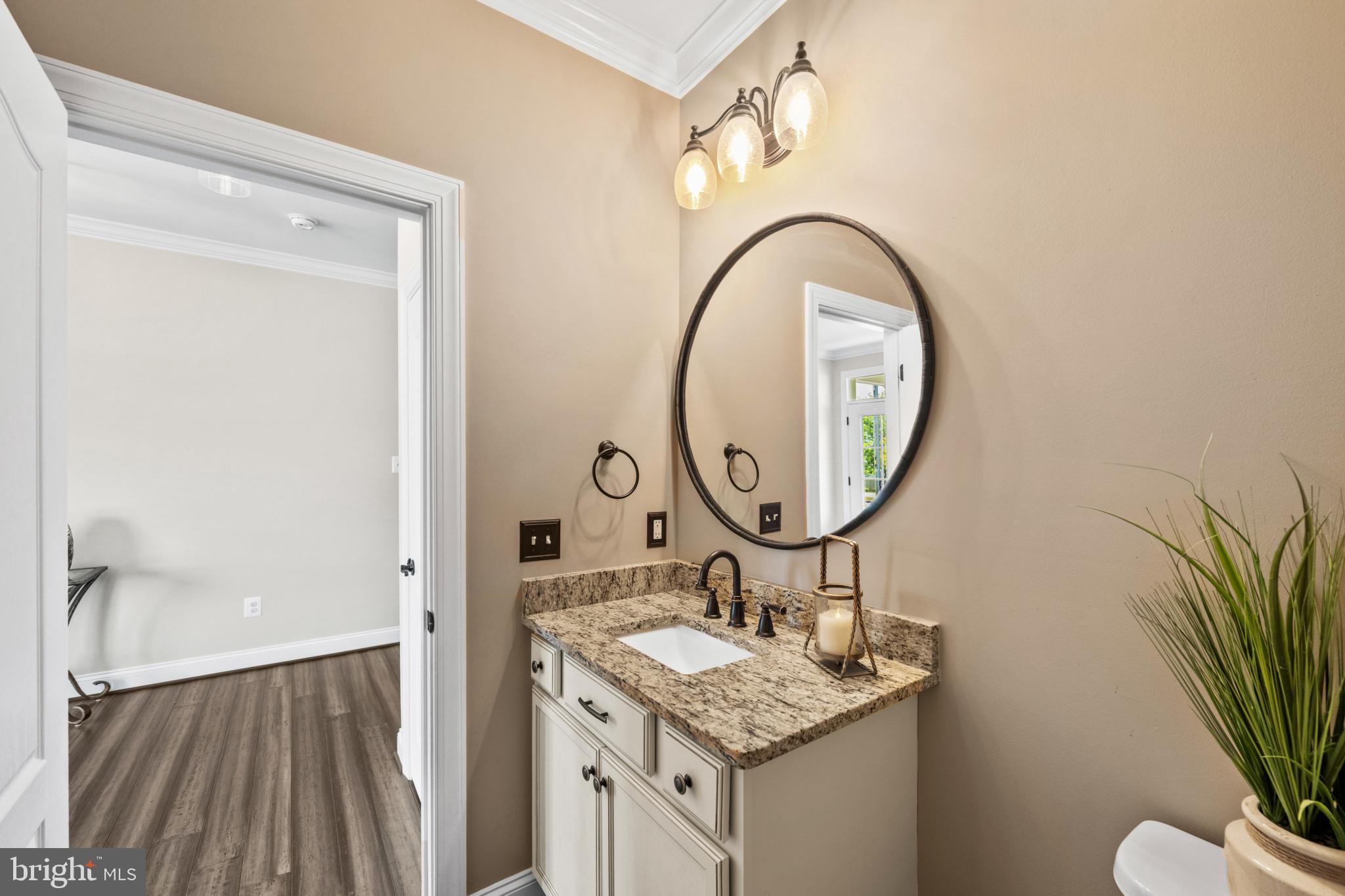 9736 Cross Road Perry Hall, MD 21128 - Photo 6 of 32 a bathroom with a sink and a mirror