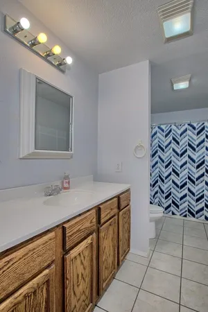 a bathroom with a sink a vanity and a mirror