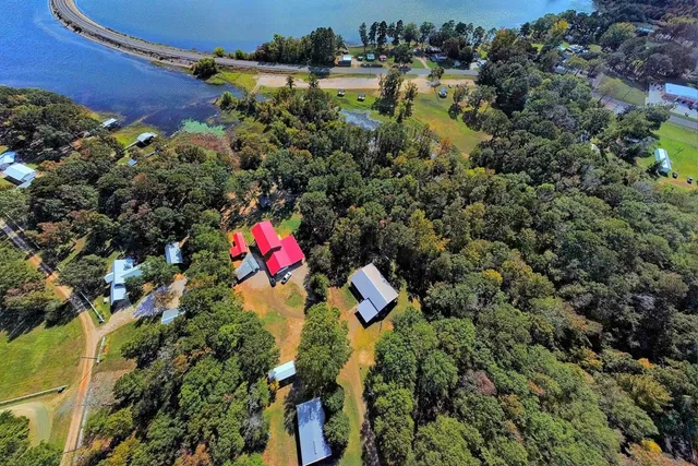 an aerial view of residential houses with outdoor space and street view