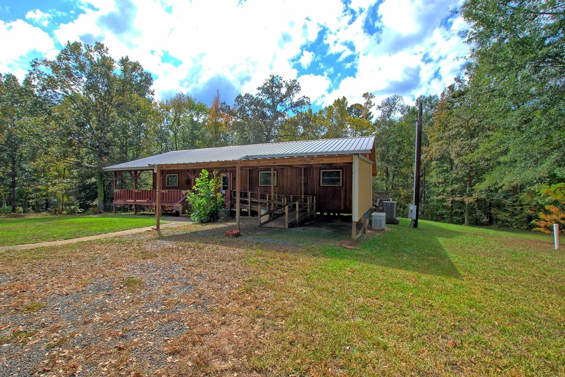 360 Oakhill Road Hemphill, TX 75948 - Photo 6 of 31 a view of a house with backyard porch and sitting area