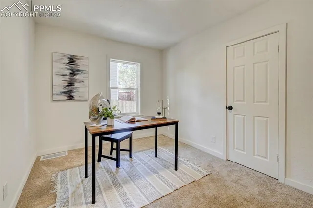 a view of a workspace with furniture
