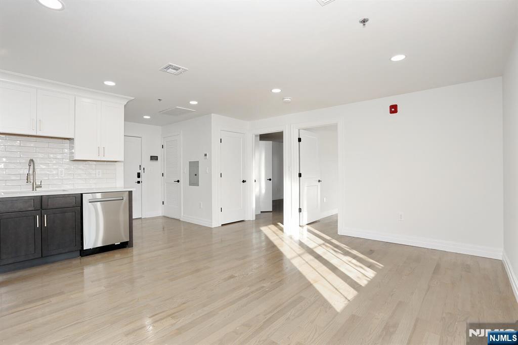 160 Terrace Street, Unit 2H Haworth, NJ 07641 - Photo 12 of 22 a view of kitchen with stainless steel appliances cabinets and wooden floor