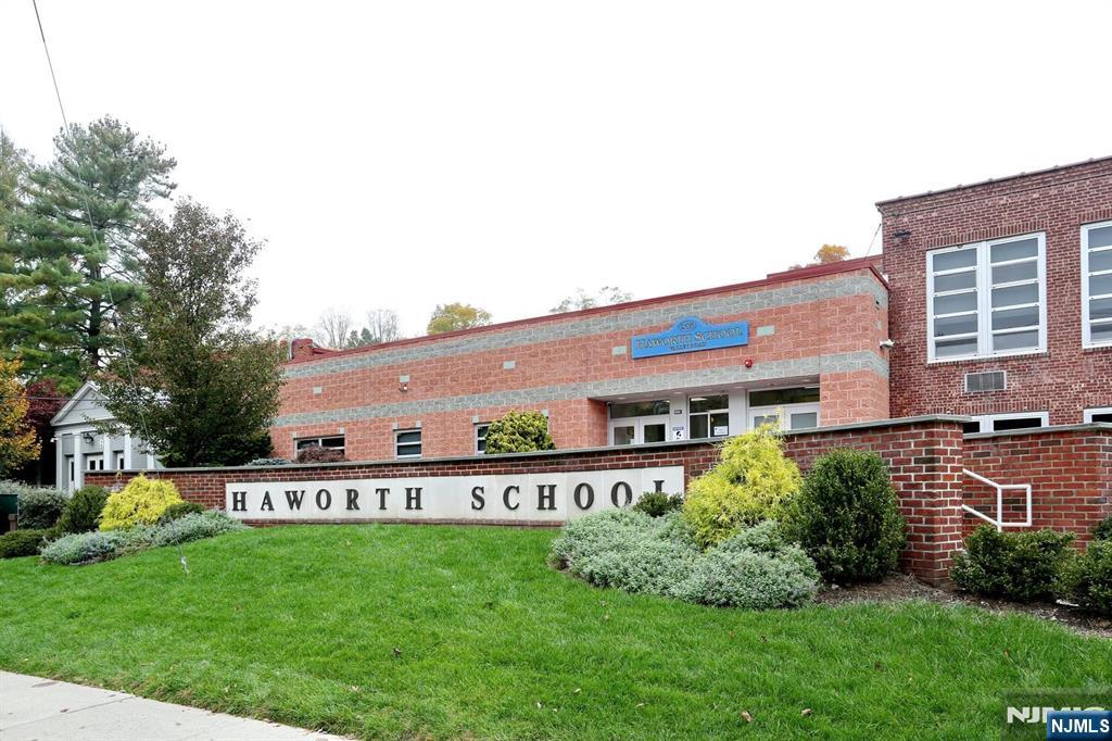 160 Terrace Street, Unit 2H Haworth, NJ 07641 - Photo 19 of 22 a view of a house with a backyard