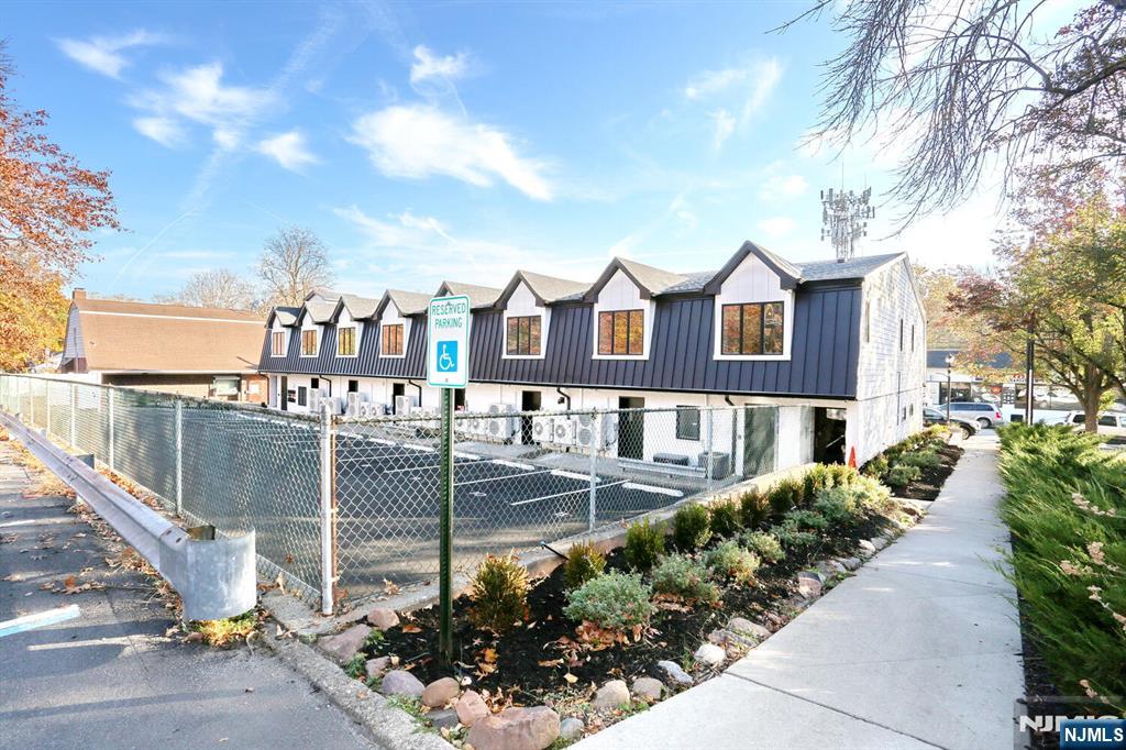 160 Terrace Street, Unit 2H Haworth, NJ 07641 - Photo 4 of 22 a view of a patio with table and chairs and potted plants
