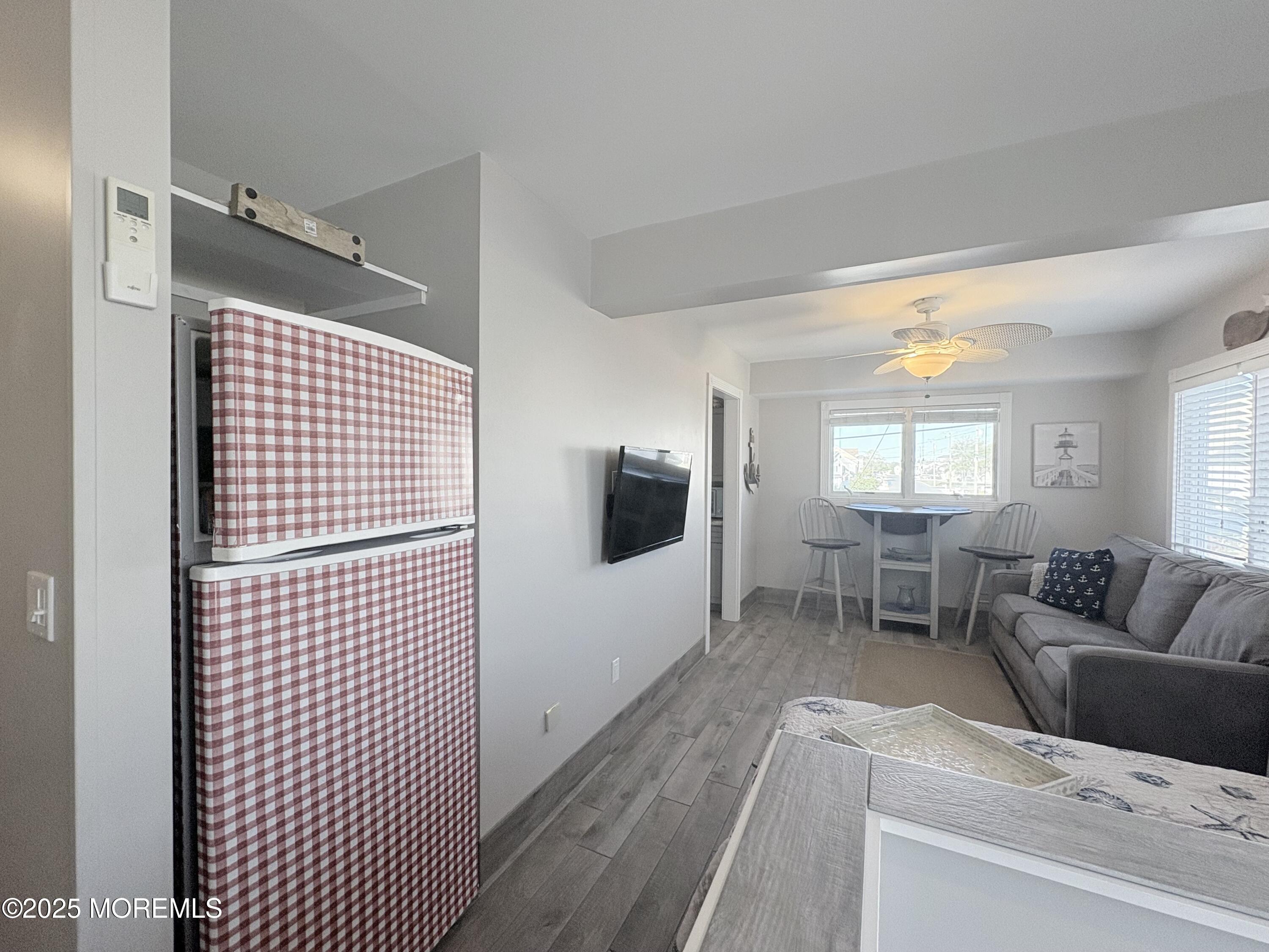 1203 Walter Boulevard Beach Haven West, NJ 08050 - Photo 4 of 11 a living room with furniture and a flat screen tv