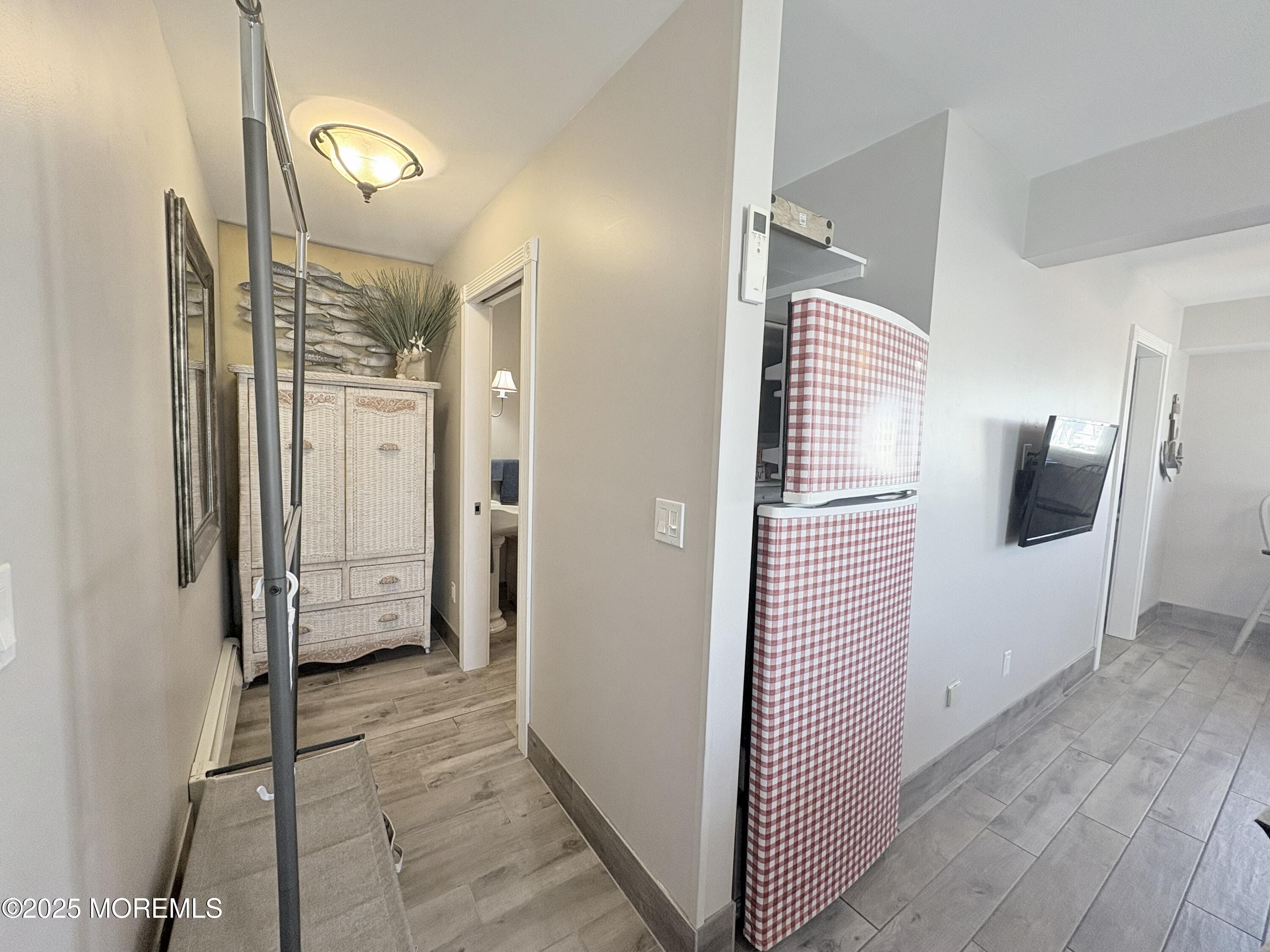 1203 Walter Boulevard Beach Haven West, NJ 08050 - Photo 5 of 11 a view of a hallway with wooden floor