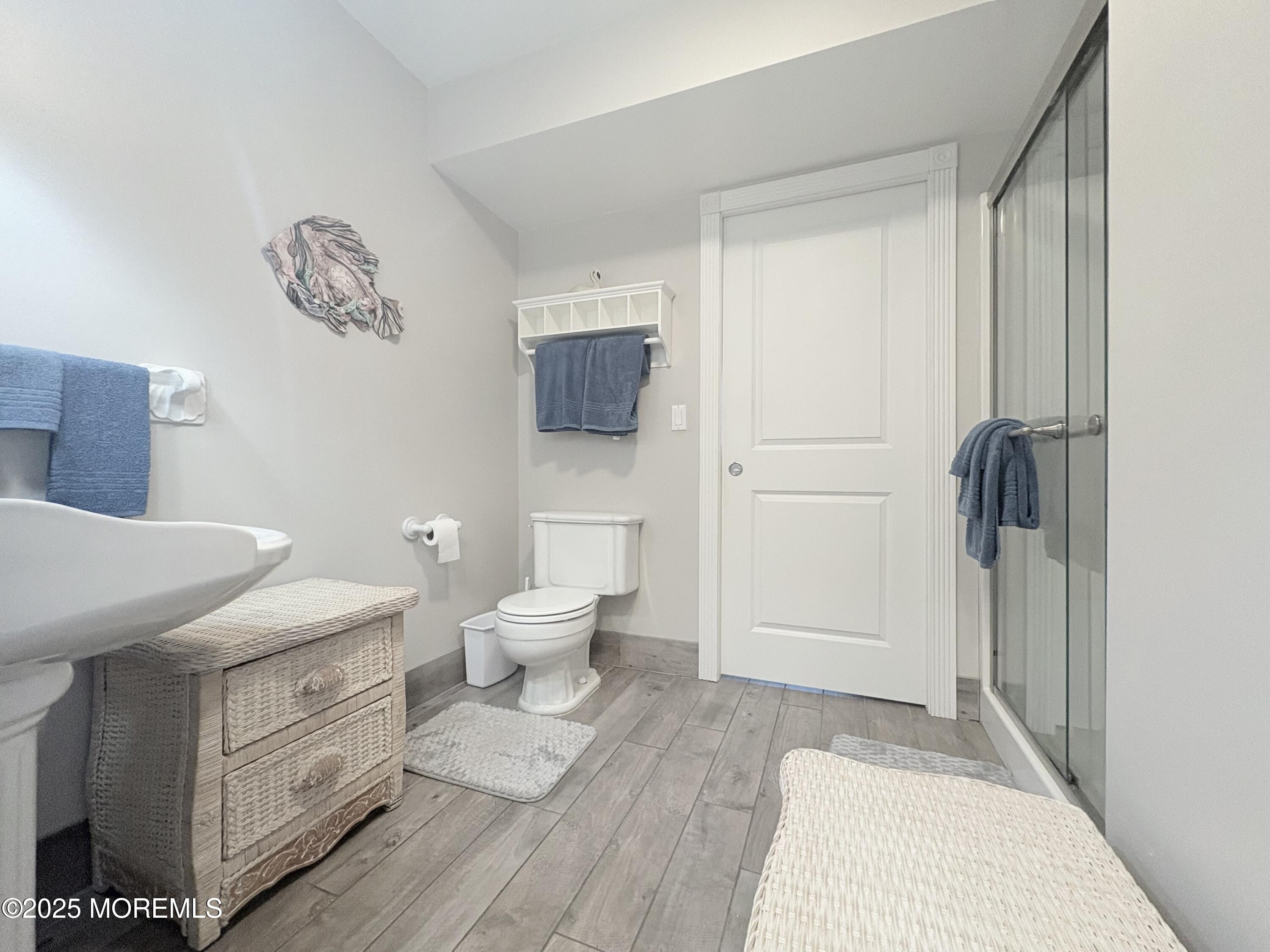 1203 Walter Boulevard Beach Haven West, NJ 08050 - Photo 6 of 11 a bathroom with a sink a toilet and a shower
