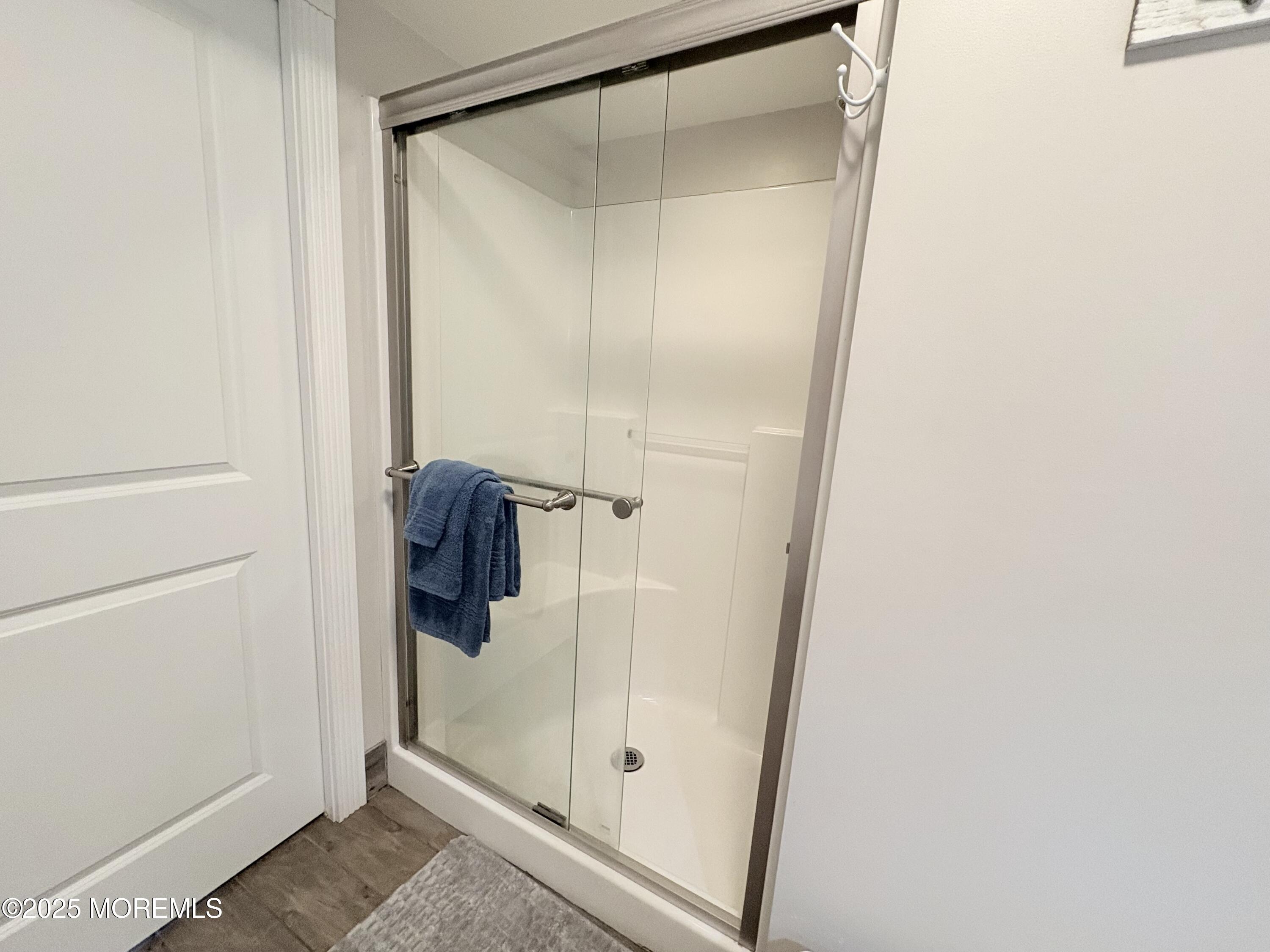 1203 Walter Boulevard Beach Haven West, NJ 08050 - Photo 7 of 11 a bathroom with a glass shower door