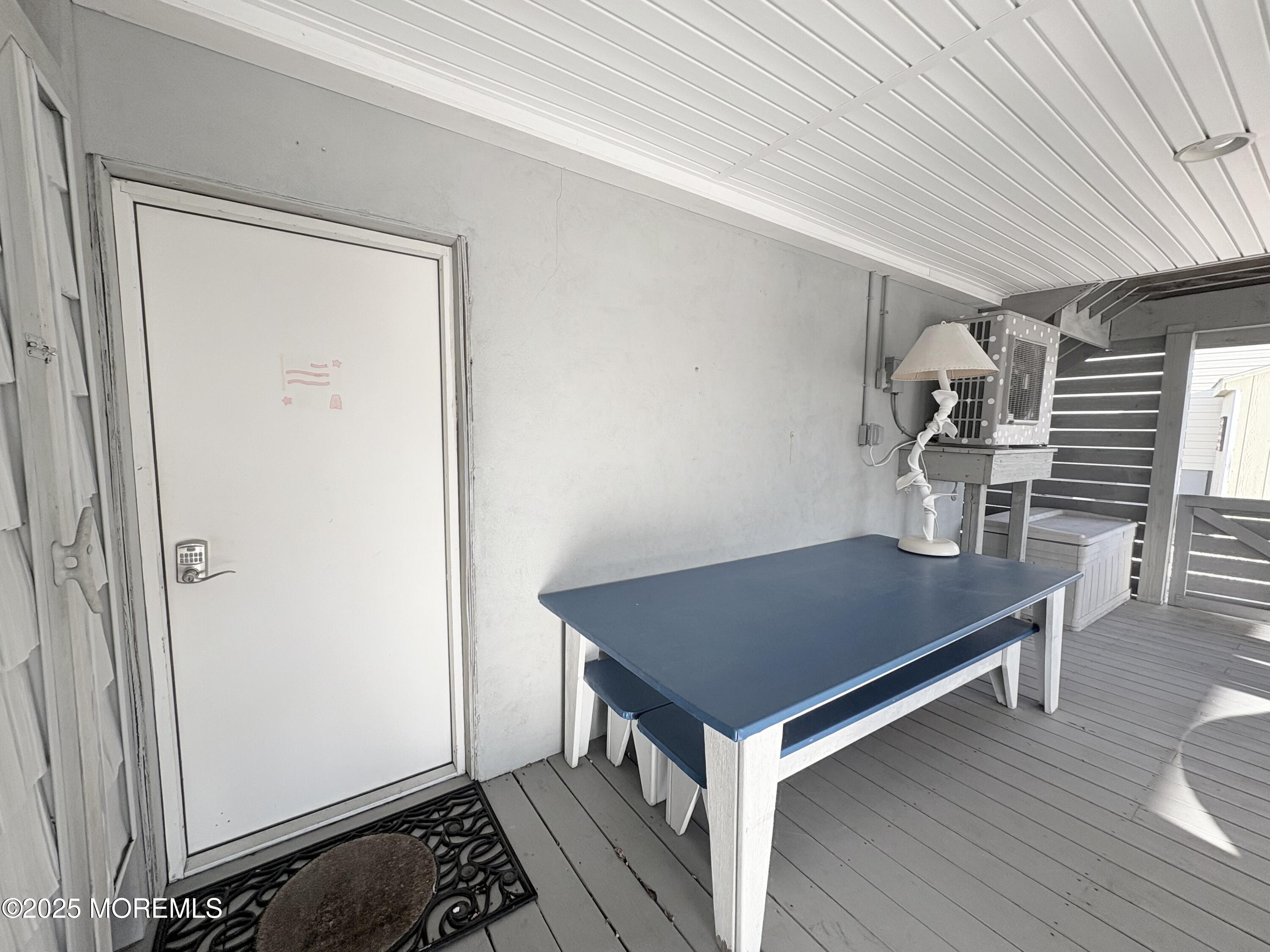 1203 Walter Boulevard Beach Haven West, NJ 08050 - Photo 10 of 11 a room with furniture and wooden floor