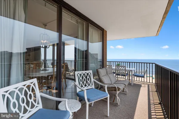 a view of balcony with furniture