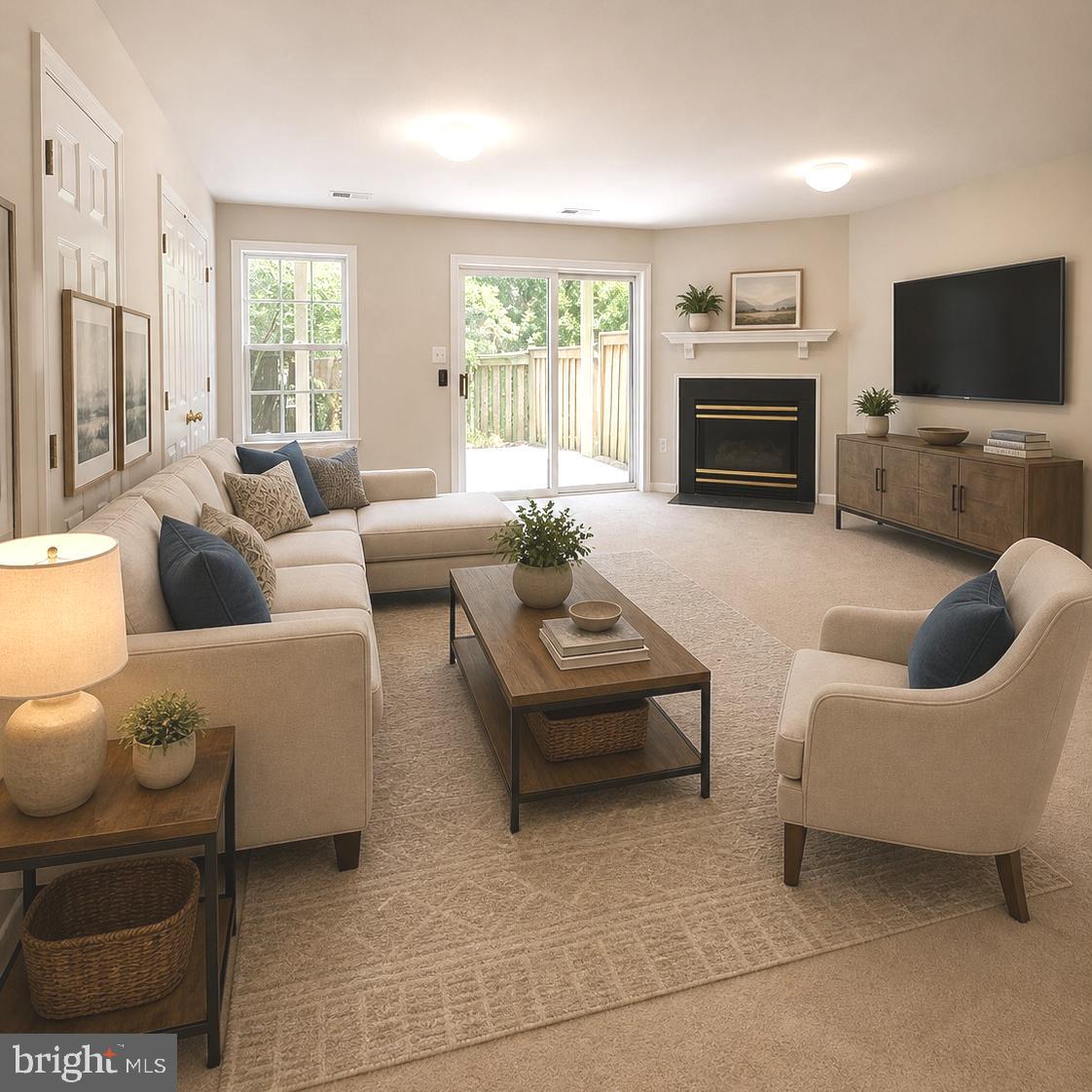 21674 Frame Square Broadlands, VA 20148 - Photo 11 of 43 a living room with furniture a flat screen tv and a fireplace