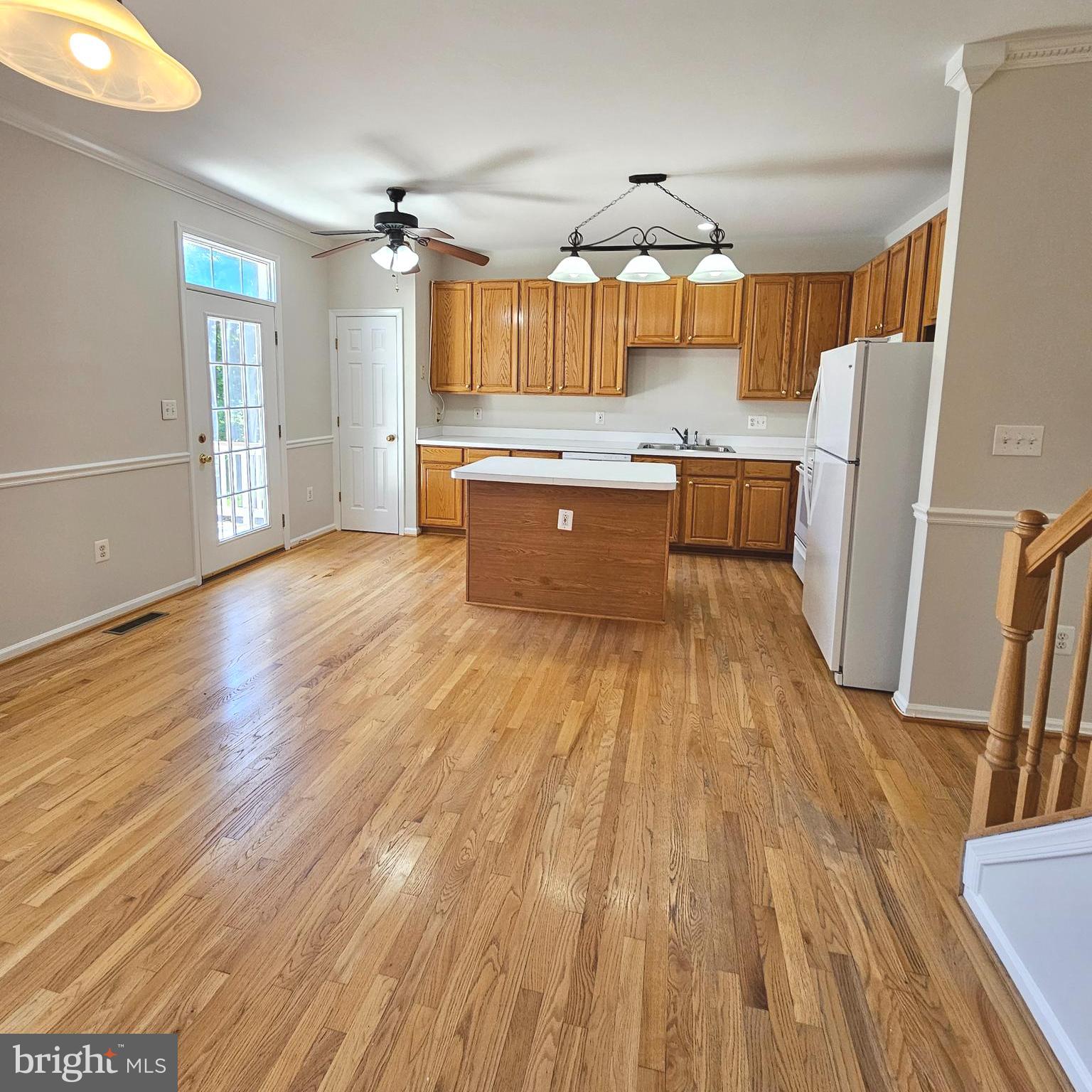21674 Frame Square Broadlands, VA 20148 - Photo 17 of 43 a large kitchen with a wooden floor and outdoor space