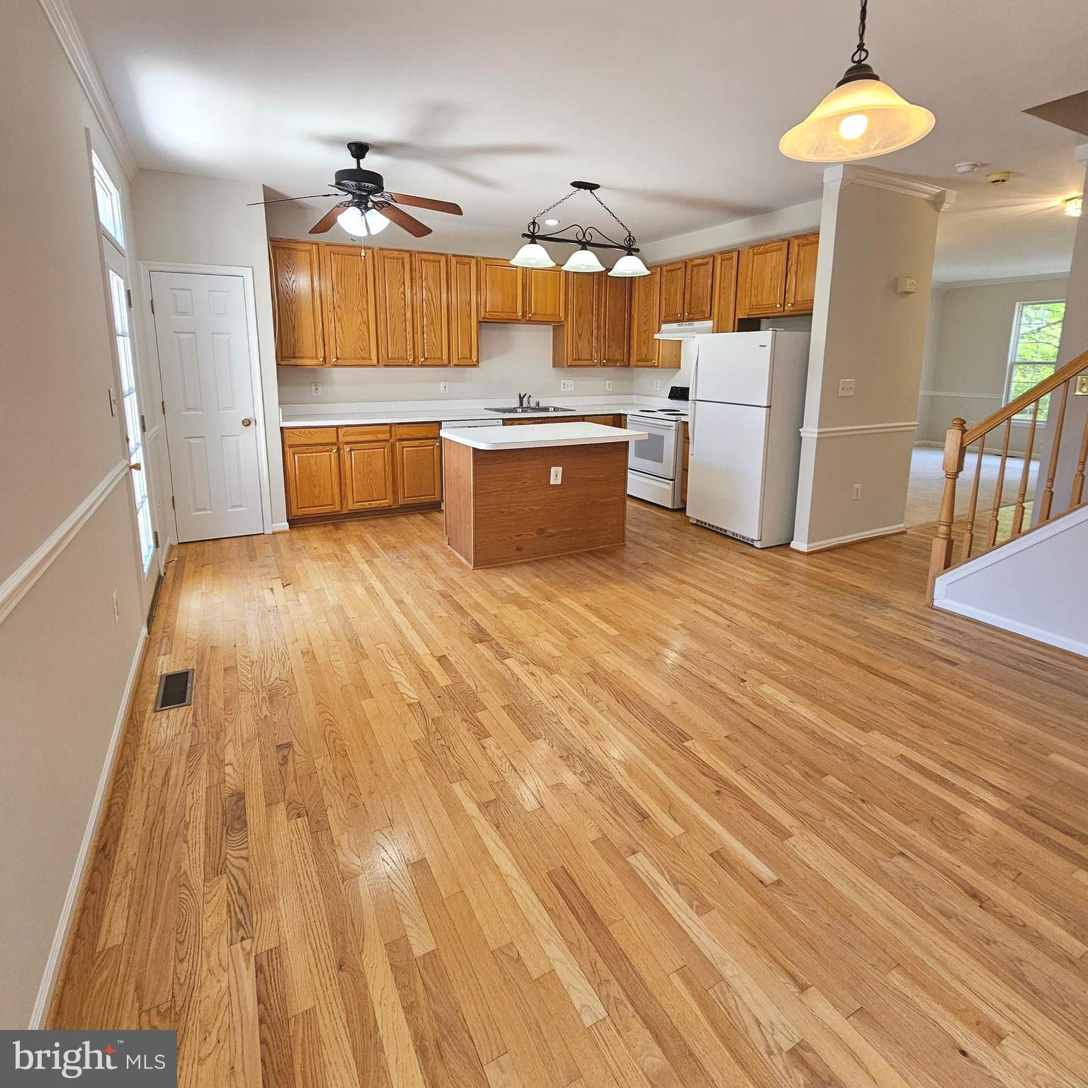 21674 Frame Square Broadlands, VA 20148 - Photo 18 of 43 a kitchen with granite countertop a sink and a stove top oven