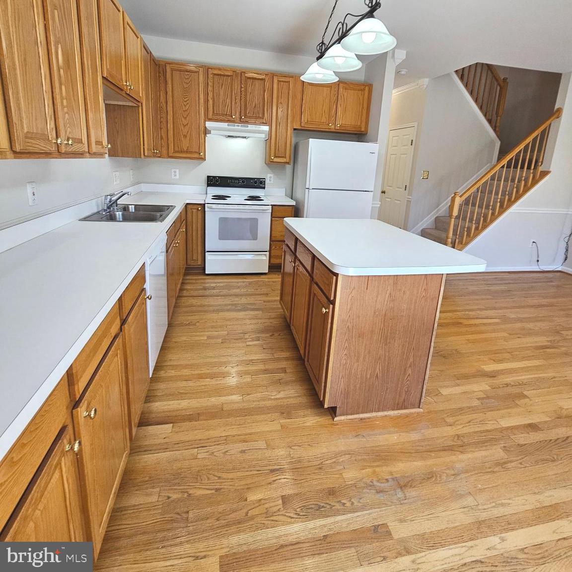 21674 Frame Square Broadlands, VA 20148 - Photo 19 of 43 a kitchen with stainless steel appliances a stove a sink and a refrigerator