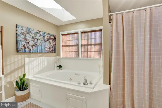 a bathroom with a sink a mirror and a toilet