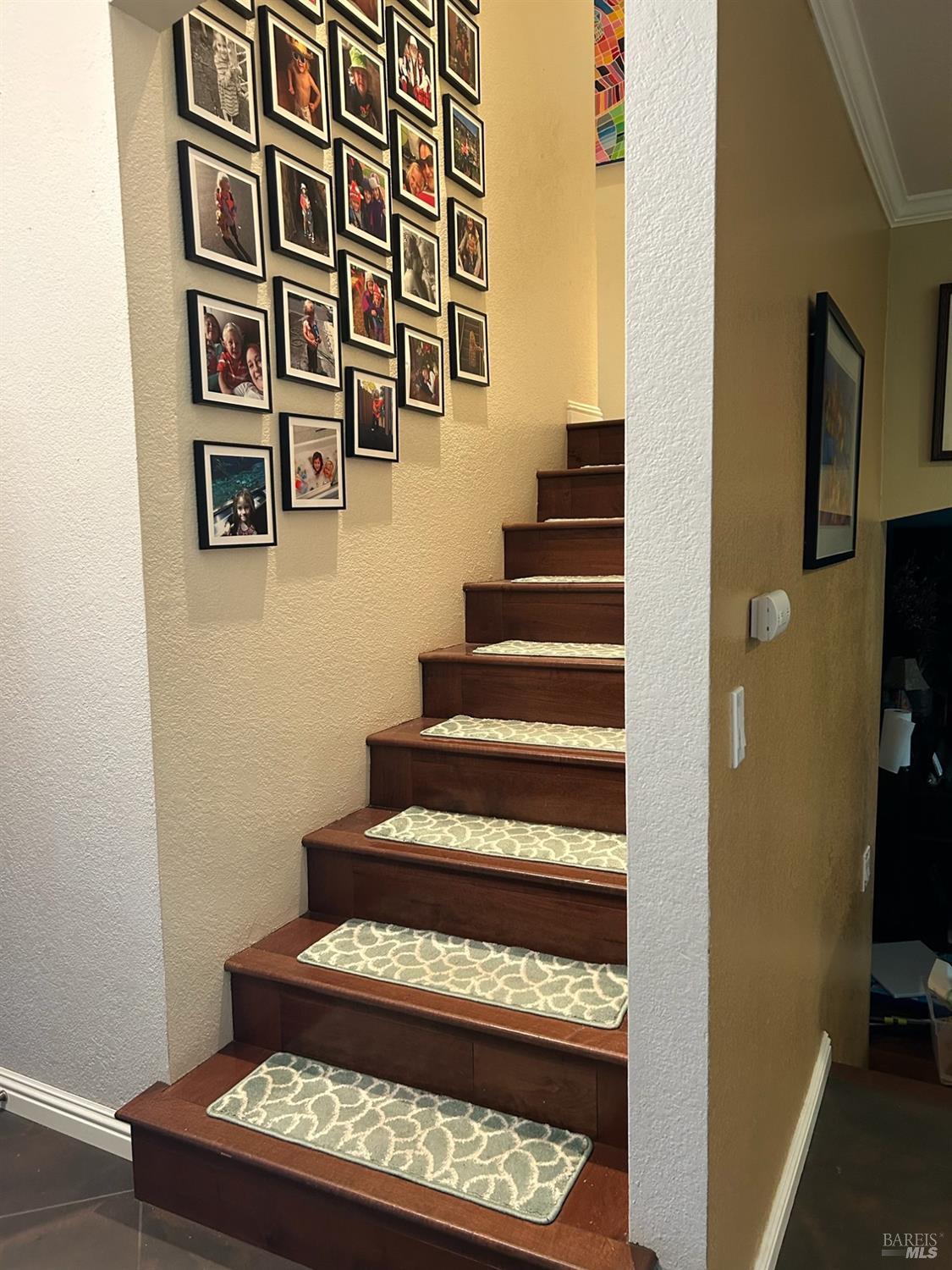 2813 Beth Court Santa Rosa, CA 95403 - Photo 12 of 24 a view of staircase with wooden floor and a rug