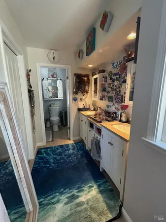 a bathroom with a toilet and a shower curtain