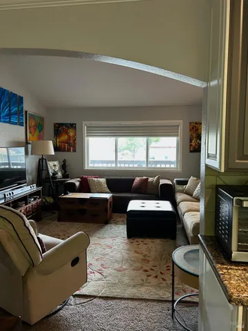 a living room with furniture and a window