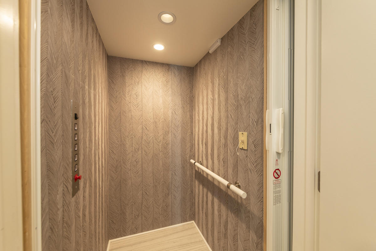 139 Simonton Street Key West, FL 33040 - Photo 13 of 68 a view of a hallway with a wooden door