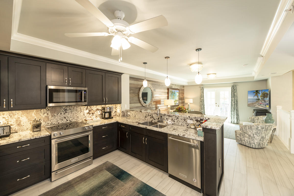 139 Simonton Street Key West, FL 33040 - Photo 3 of 68 a kitchen with a stove and a sink