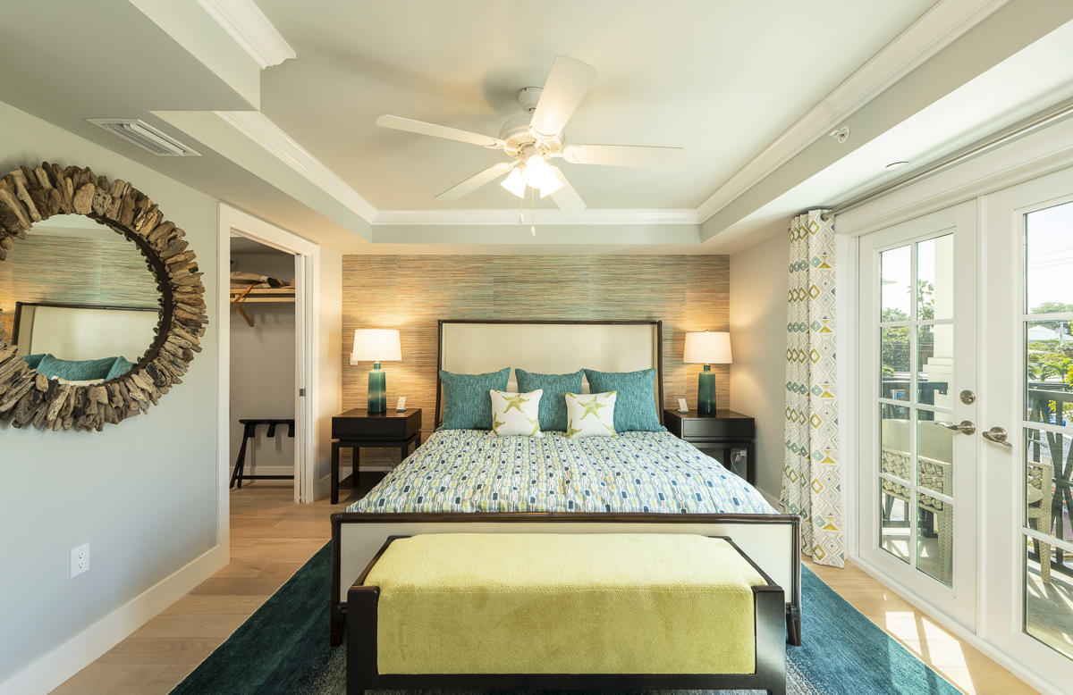 139 Simonton Street Key West, FL 33040 - Photo 24 of 68 a bed room with a bed and a table