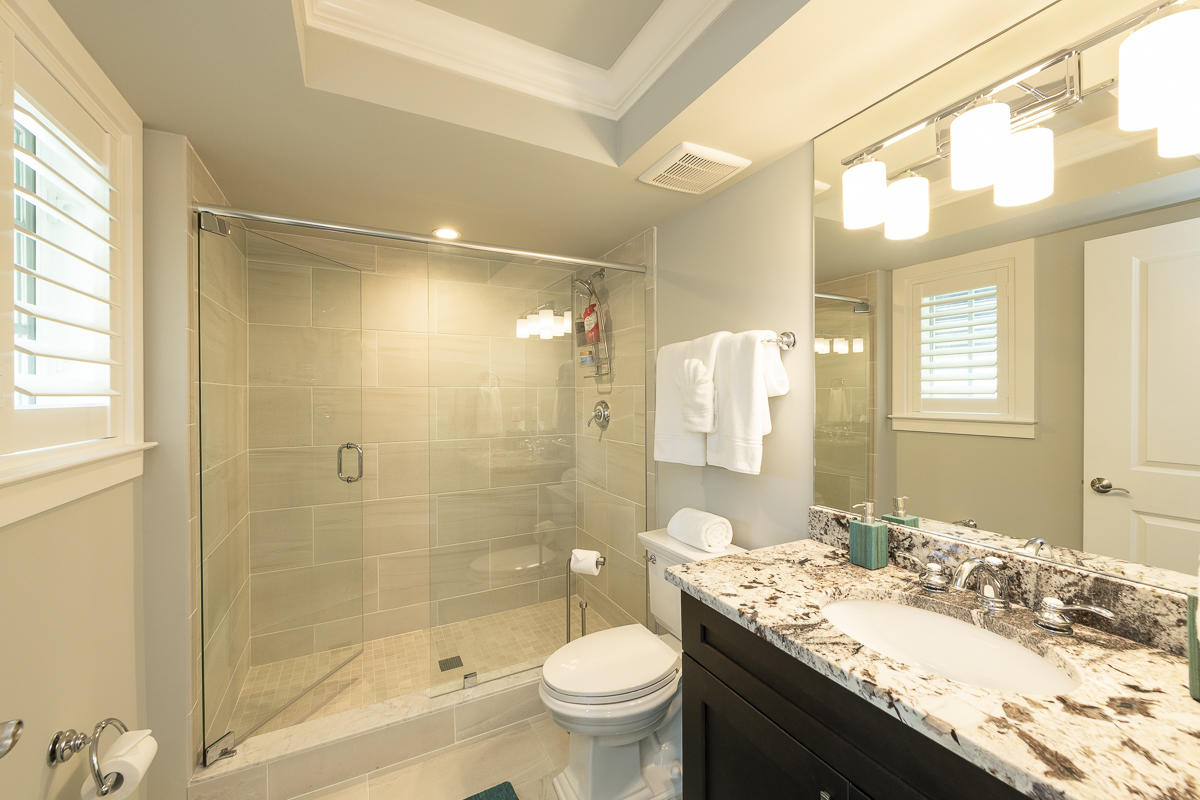 139 Simonton Street Key West, FL 33040 - Photo 26 of 68 a bathroom with a granite countertop sink toilet and shower