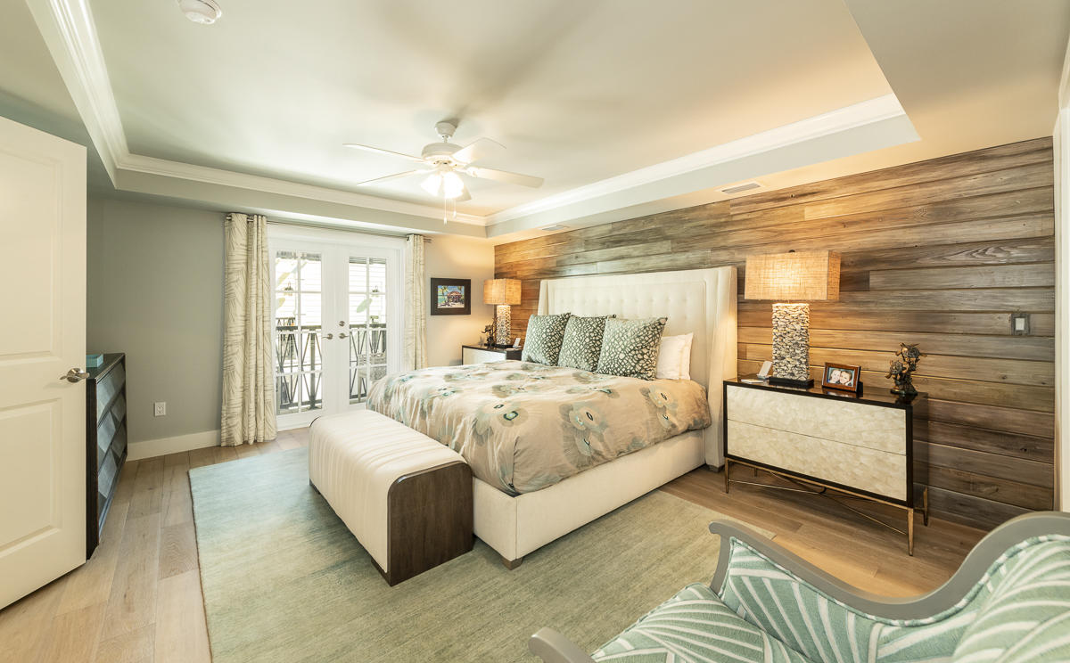 139 Simonton Street Key West, FL 33040 - Photo 30 of 68 a spacious bedroom with a bed and a couch