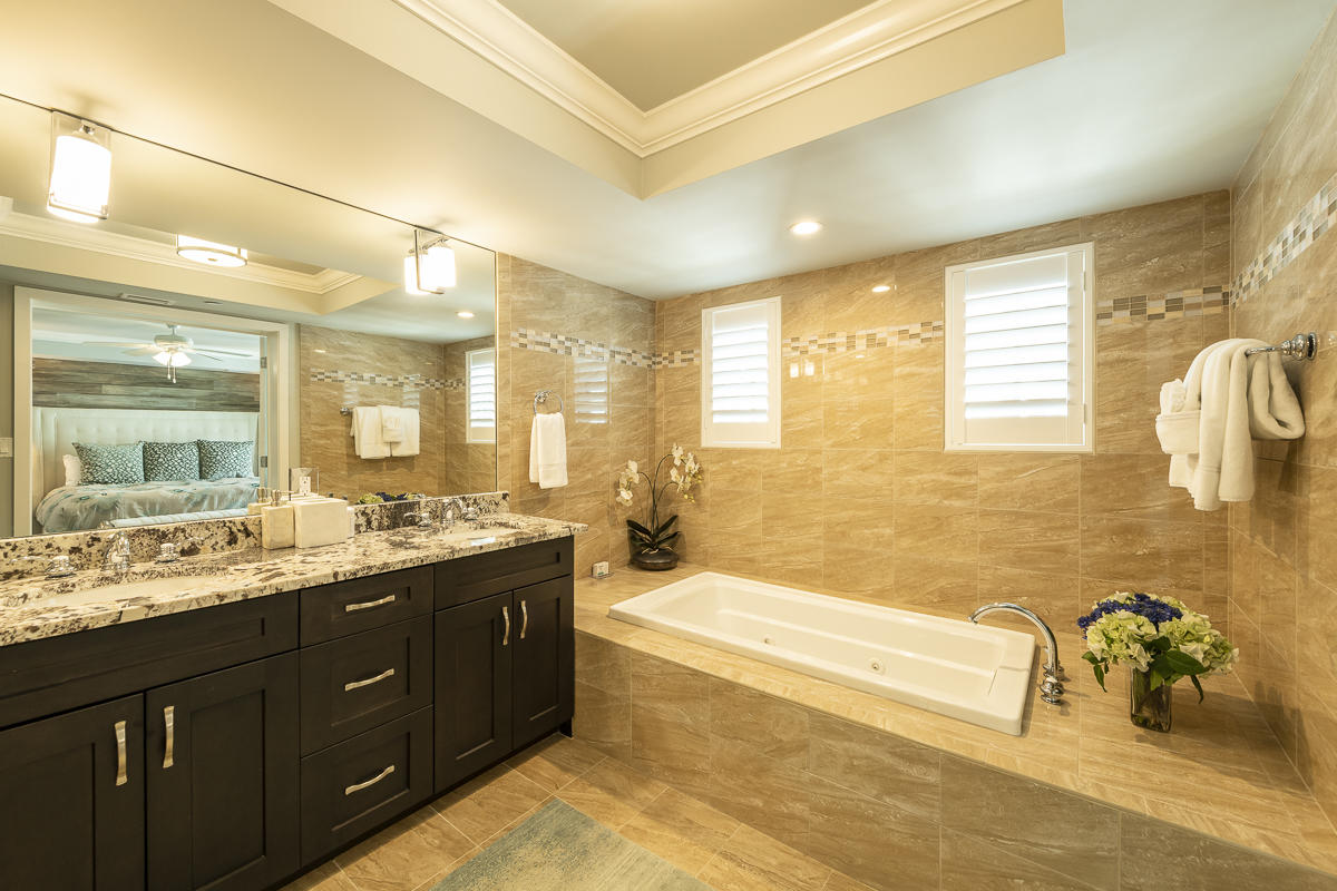 139 Simonton Street Key West, FL 33040 - Photo 36 of 68 a spacious bathroom with a granite countertop tub sink shower and mirror