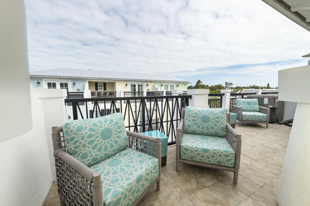 139 Simonton Street Key West, FL 33040 - Photo 48 of 68 a balcony with furniture and a potted plant