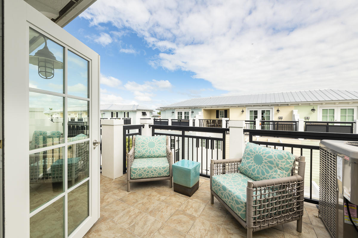139 Simonton Street Key West, FL 33040 - Photo 50 of 68 a view of a chair and table in the balcony