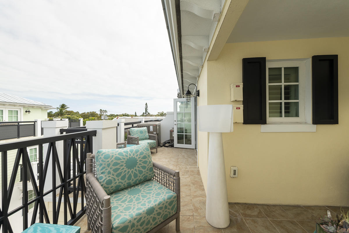 139 Simonton Street Key West, FL 33040 - Photo 51 of 68 a view of a balcony with furniture and city view