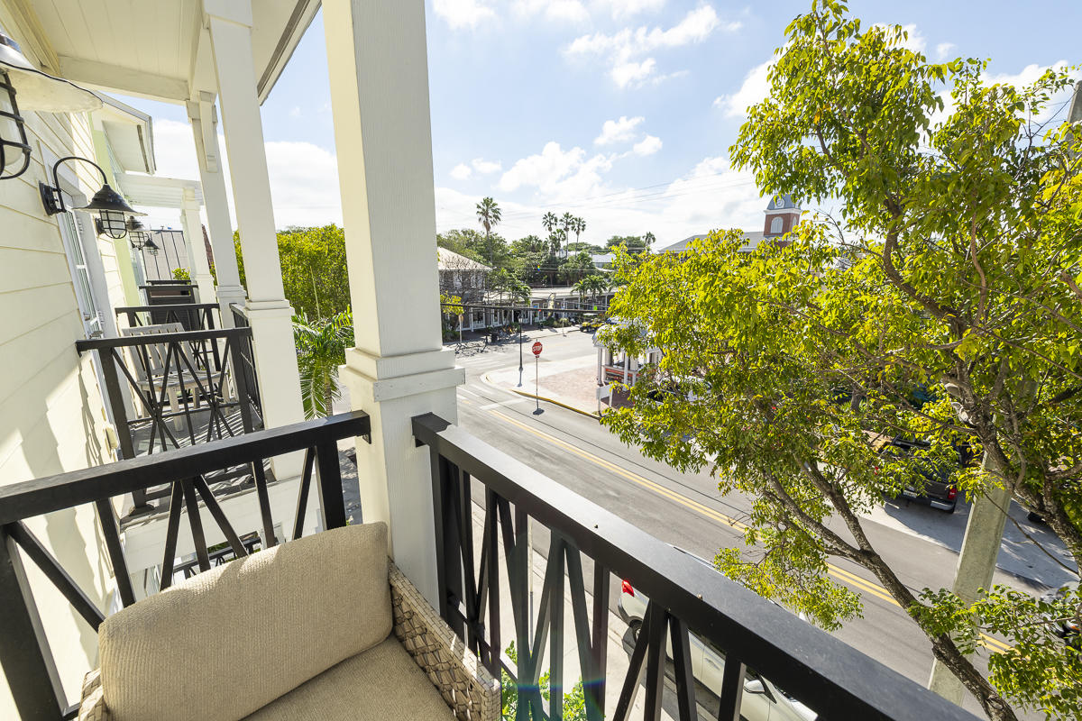 139 Simonton Street Key West, FL 33040 - Photo 62 of 68 a view of a balcony with furniture