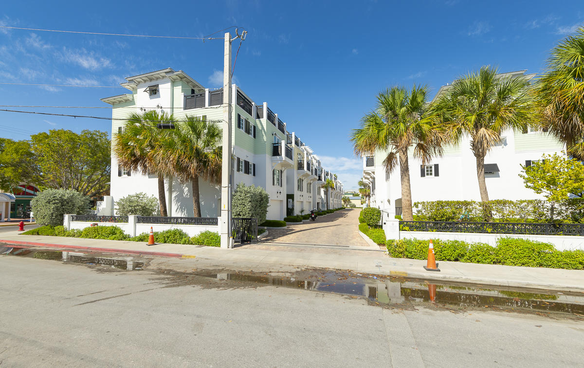 139 Simonton Street Key West, FL 33040 - Photo 65 of 68 a front view of a house with a yard and palm trees