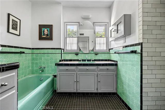 a bathroom with a sink a toilet and bathtub