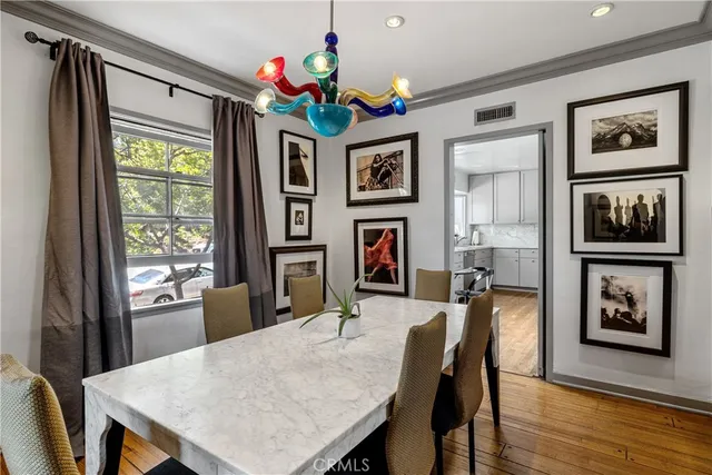 a view of a dining room with furniture window and wooden floor