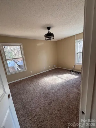 en empty room with windows