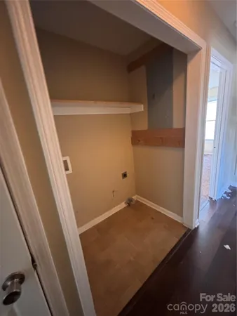 a room with a sink and cabinets
