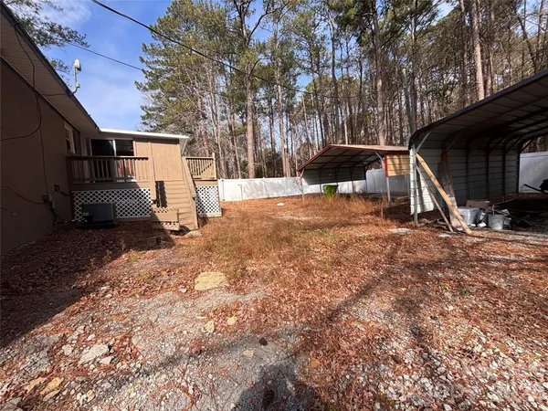 a view of backyard with large trees