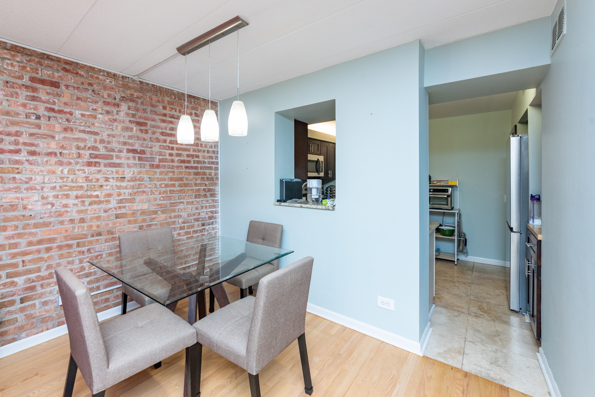 651 West Sheridan Road, Unit 2B Chicago, IL 60613 - Photo 5 of 16 a view of a dining room with furniture