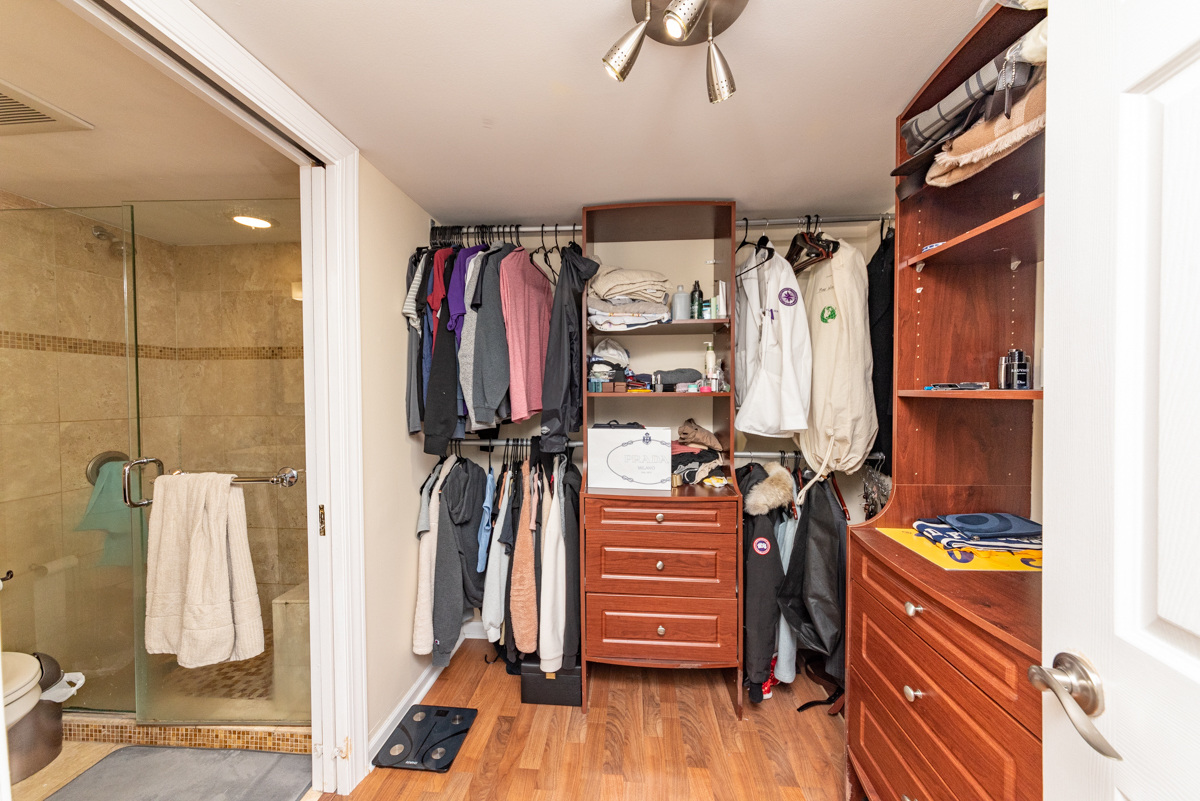 651 West Sheridan Road, Unit 2B Chicago, IL 60613 - Photo 9 of 16 a view of walk in closet with clothes and shoes