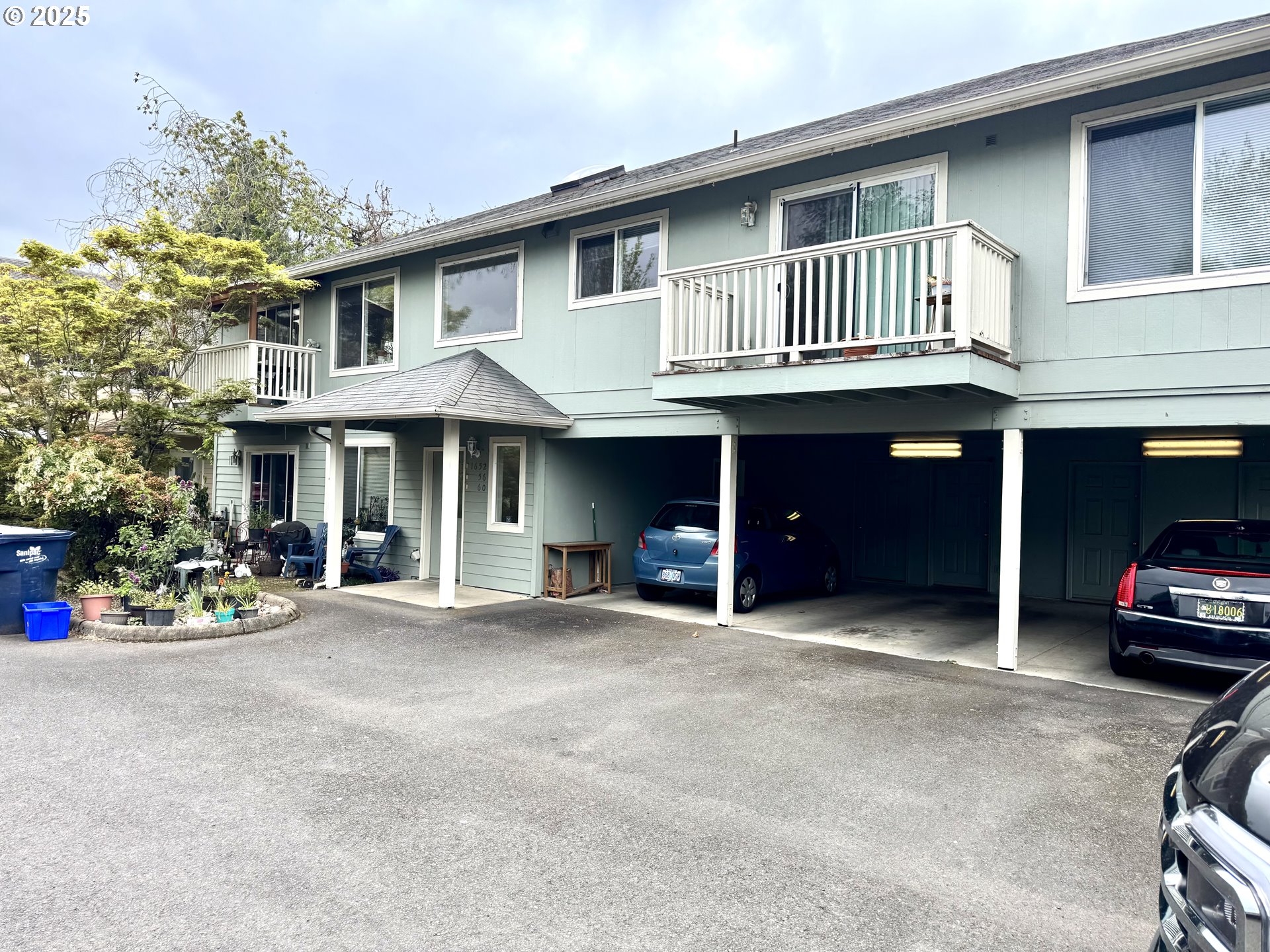 a view of a car park in front of house