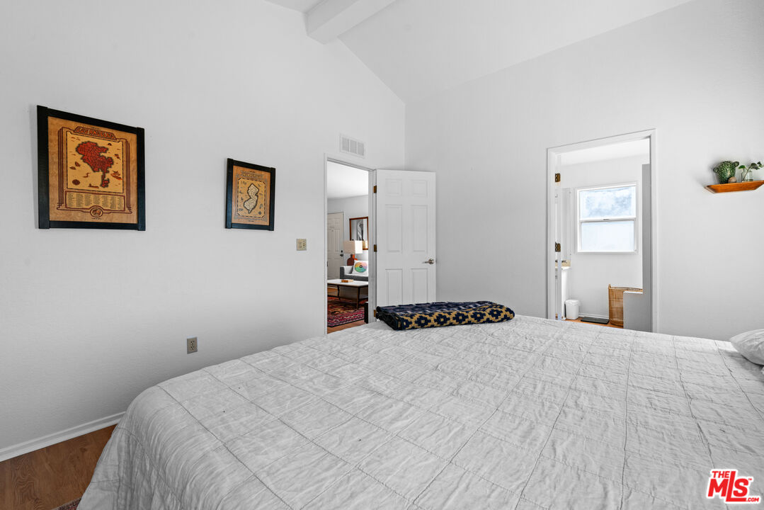 1794 Rebel Road Acton, CA 93551 - Photo 14 of 36 a bedroom with a bed and painting on the wall