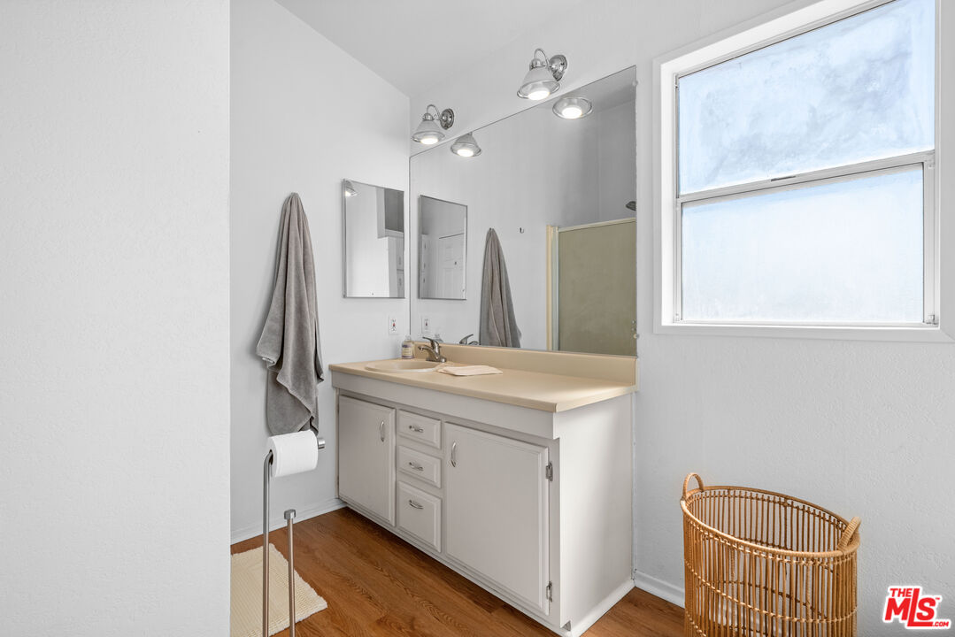 1794 Rebel Road Acton, CA 93551 - Photo 15 of 36 a bathroom with a sink a toilet and a mirror
