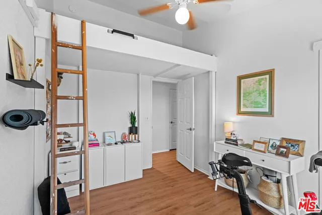 a bedroom with a workspace