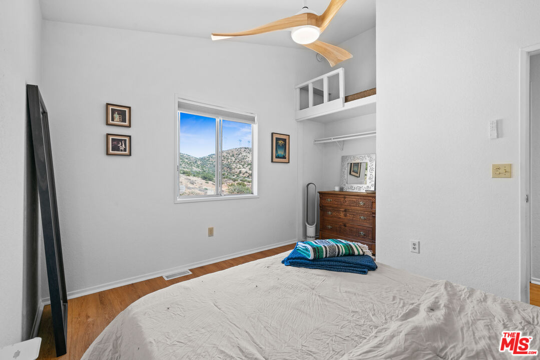 1794 Rebel Road Acton, CA 93551 - Photo 23 of 36 a bedroom with a bed and a window