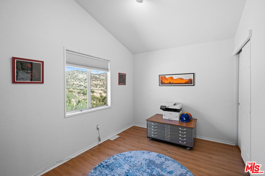 1794 Rebel Road Acton, CA 93551 - Photo 25 of 36 a bedroom with bed and a window